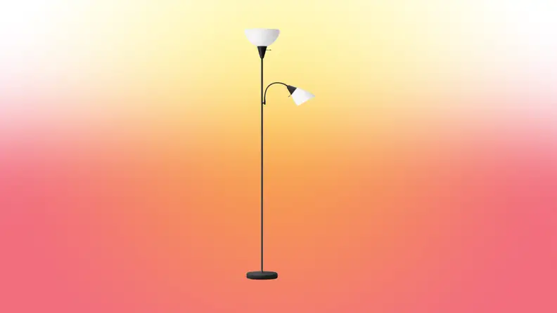 A lamp stands on a red and yellow fade background