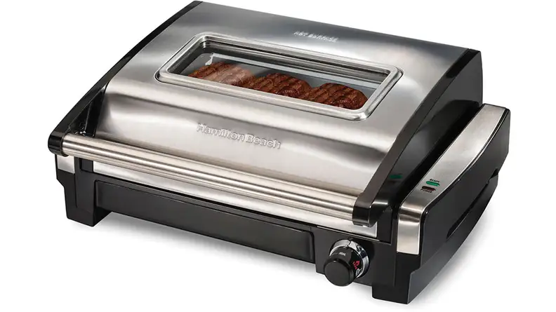 A silver  Hamilton Beach Searing Grill with Window viewed from a front left angle.