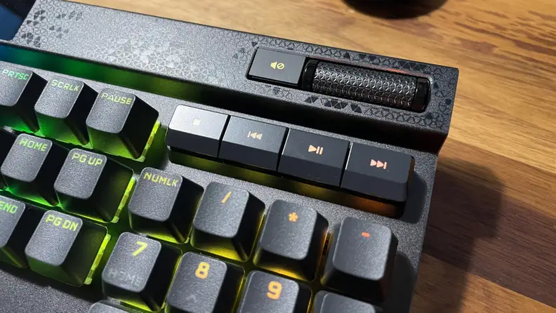 A close up of the media keys on a Corsair K70 Max RGB keyboard, including volume roller.