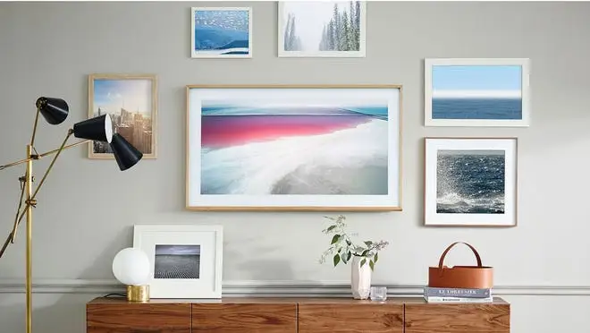 Pictures in frames hanging on wall in home.