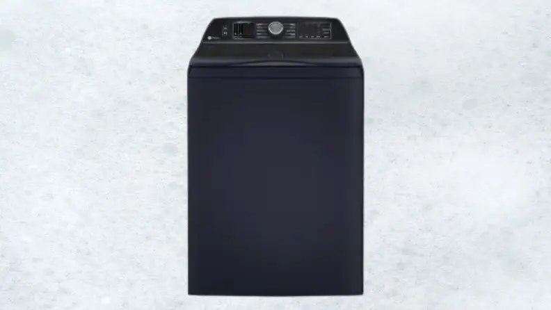 A dark blue washing machine sits on a white sudsy background