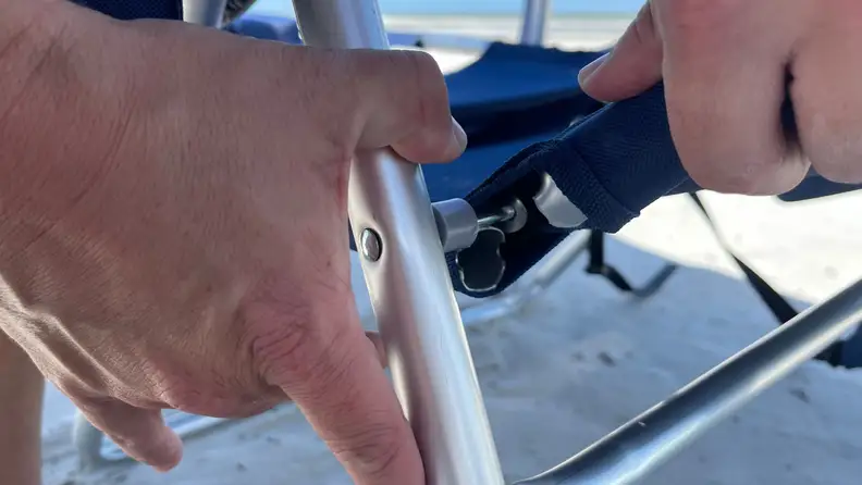 THe broken aluminum frame of the beach chair