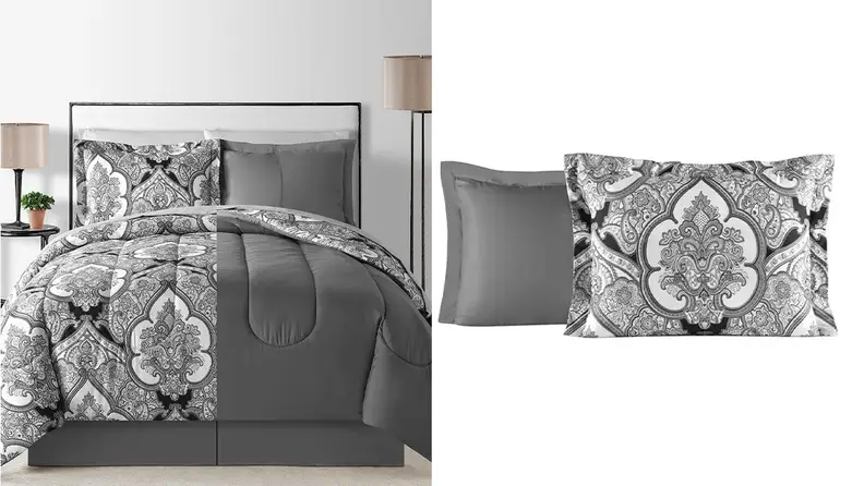 A Queen sized bed with a reversible comforter. One side is plain grey, the other has a grey and white paisley design.
