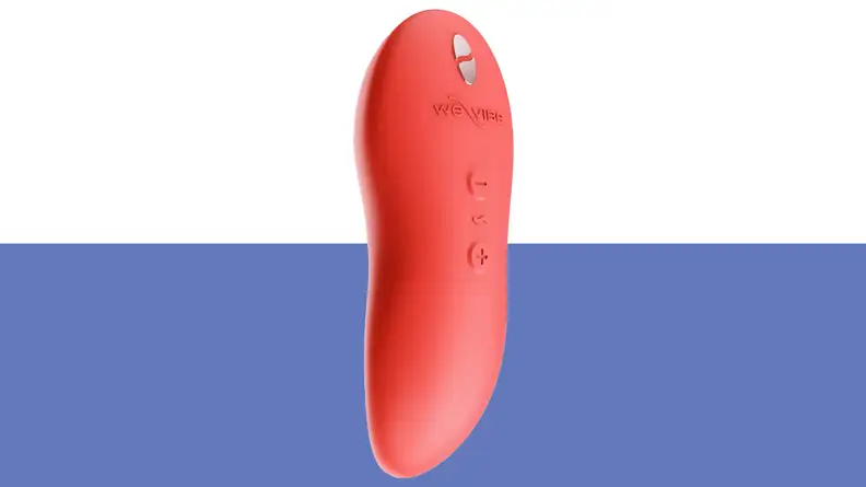Product shot of the We-Vibe Touch X vibrator in the color coral red.
