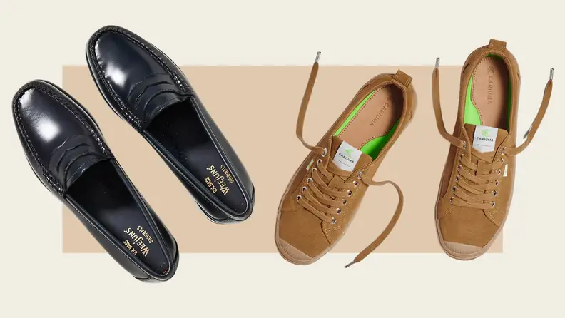 Close up of black loafers and tan sneakers.
