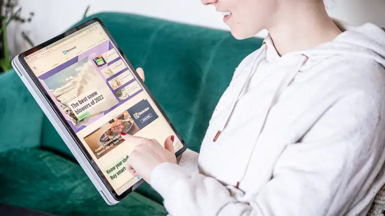person uses laptop as tablet