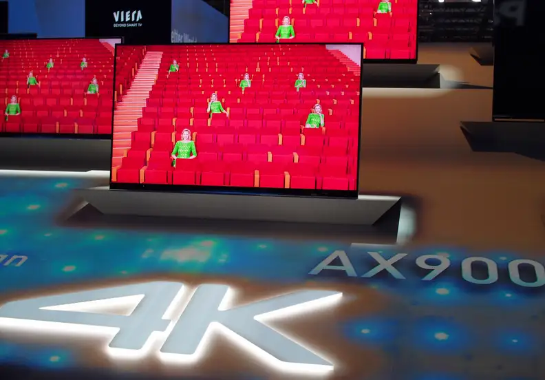 Panasonic's full-array AX900 UHD TV perched high above media heads at IFA 2014.