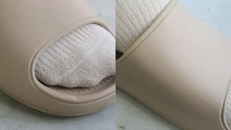 Close-up shot of Litfun's pool slide Yeezy Slide dupe showing off tiny ding on shoe, as well as creasing from packaging.