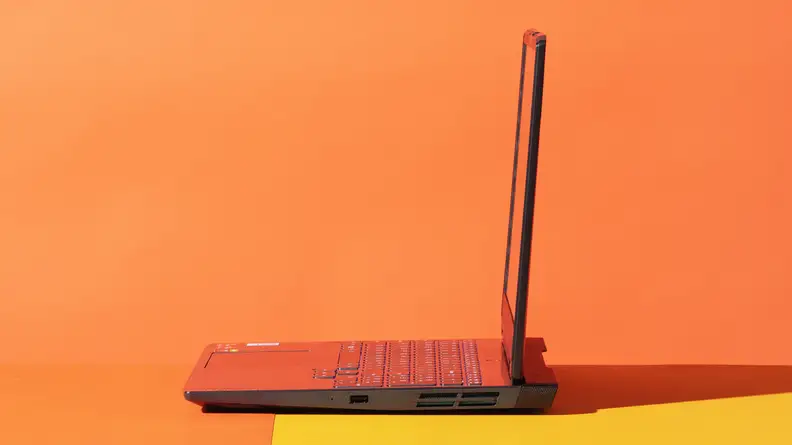 A laptop with an open lid viewed from a 90 degree angle