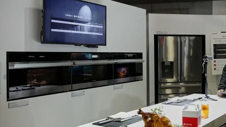 Kitchen set with three built-in Sharp wall ovens