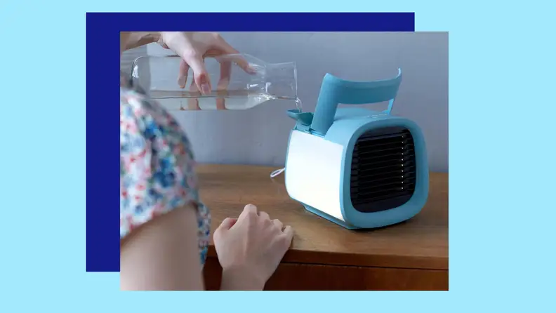 A person pouring water into an evaporative cooler.