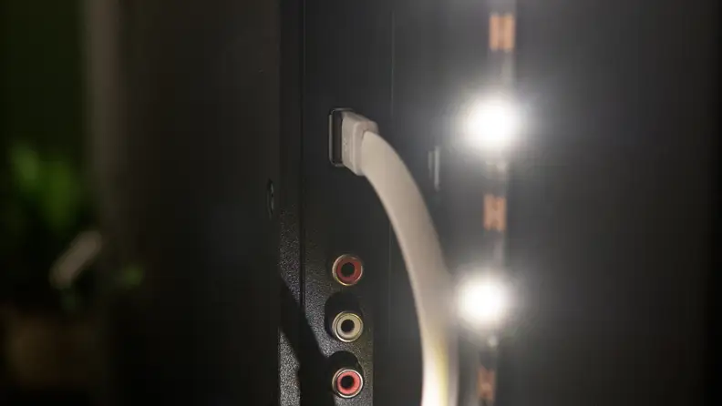 The USB cable for the bias LED light strip connected via USB to a TV