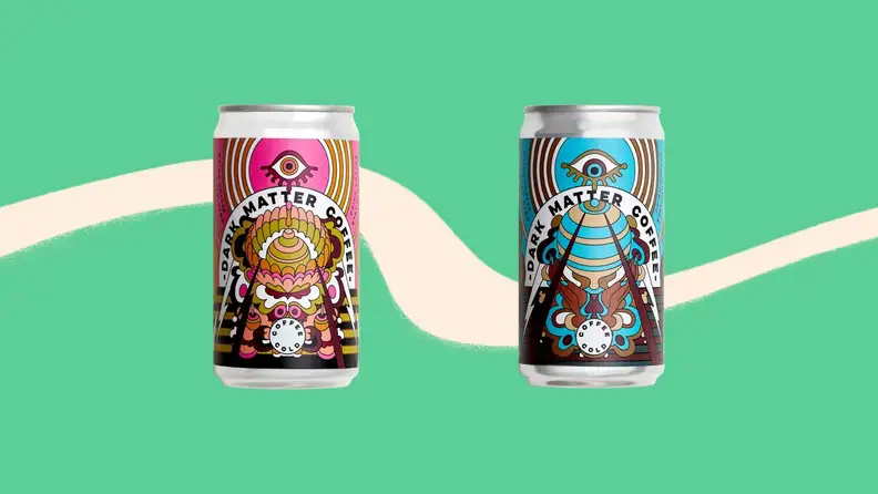 Two cans of coffee arranged in a straight line on a green background.