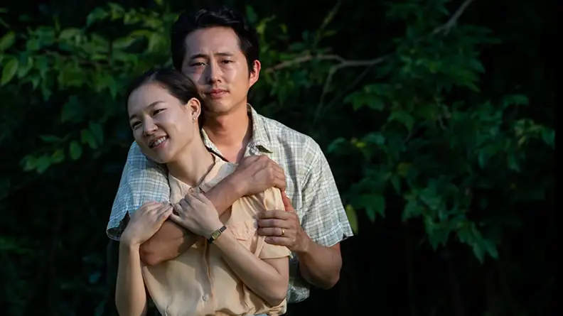 A still of the movie Minari featuring Steven Yeun and Han Ye Ri.