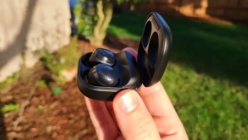 Close-up: the Samsung Galaxy Buds Pro in their tiny black carrying case.