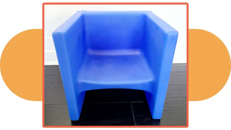 A blue Children's Factory Store cube chair.