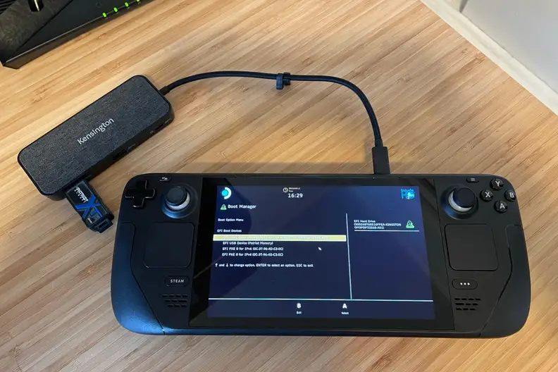 A black handheld gaming console showing part of the Windows 11 OS installation process
