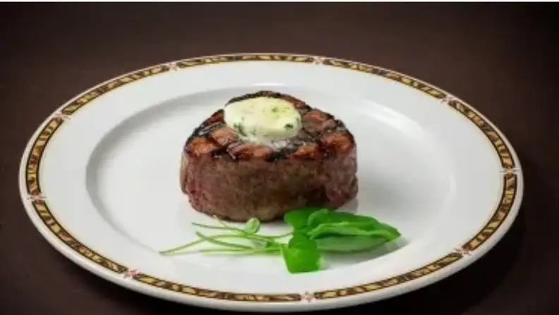 A filet mignon on a white plate