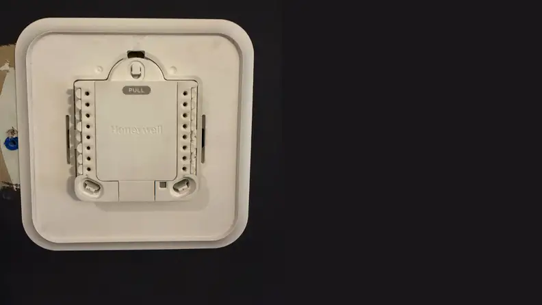 The back of a smart thermostat