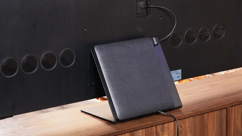 The One Connect box being used on the back of the Samsung S95D QD-OLED TV as a television stand.
