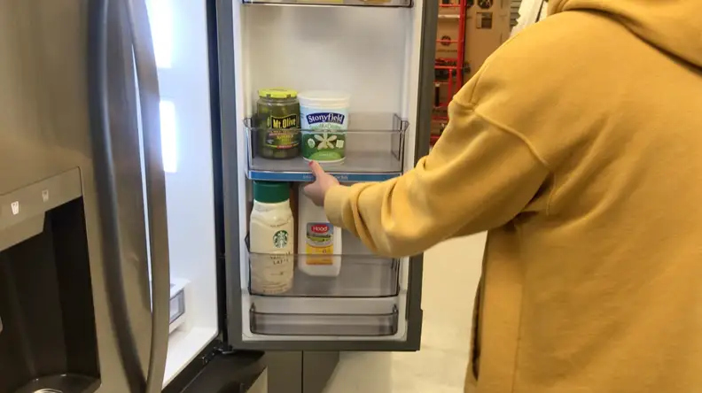A short video in which one of our lab technicians in a yellow sweatshirt showcases how the Click & Glide door bin slides up and down.