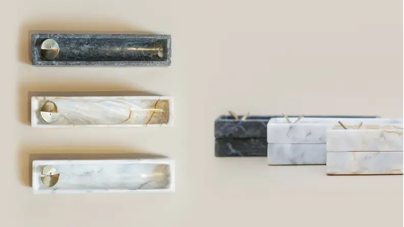 Left: top-down view of three incense boxes, Right: close-up of brass piece on incense boxes