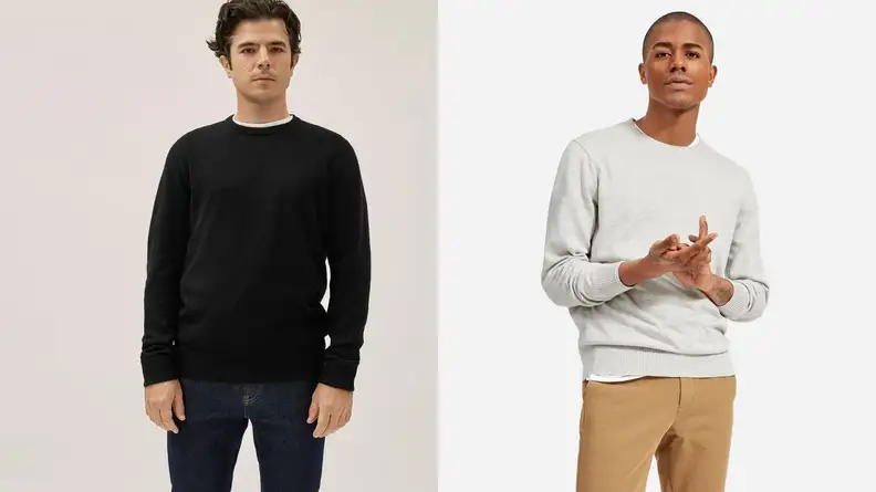 Man wearing black crewneck sweatshirt from Everlane, man folding hands while wearing a grey Everlane sweatshirt.