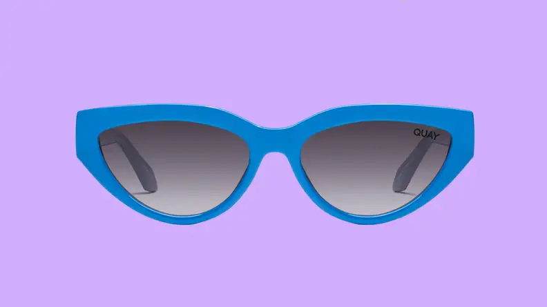 An image of a pair of bright blue cat-eye sunglasses.
