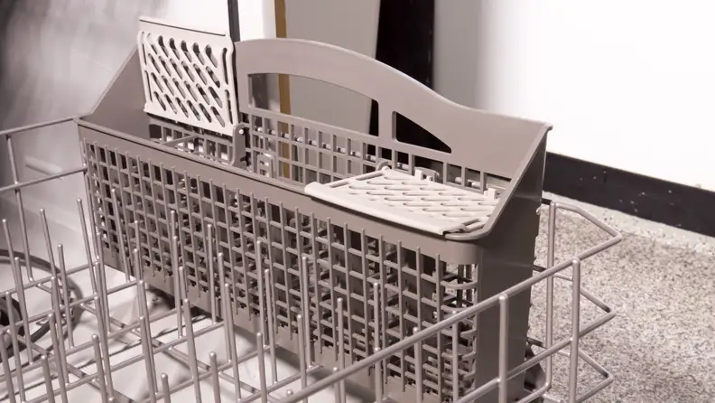 The silverware basket is removable and has slots for individual pieces