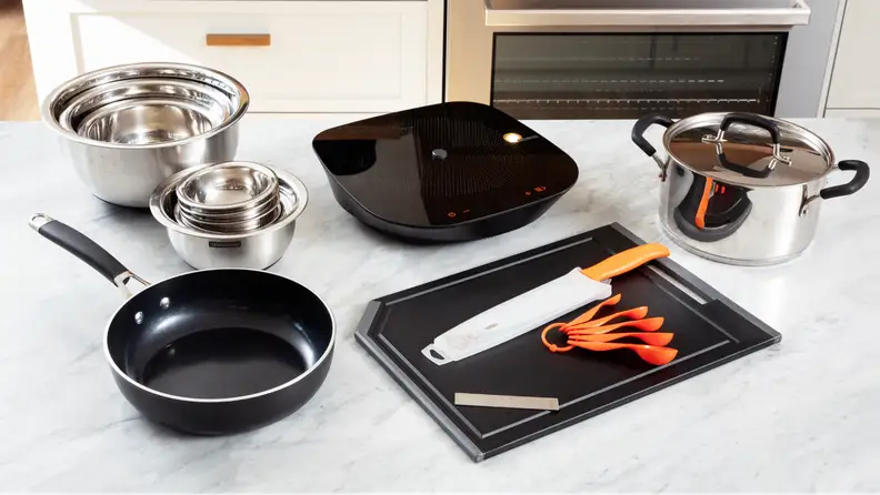 The full Tramontina Guru set laid out on display on a countertop.