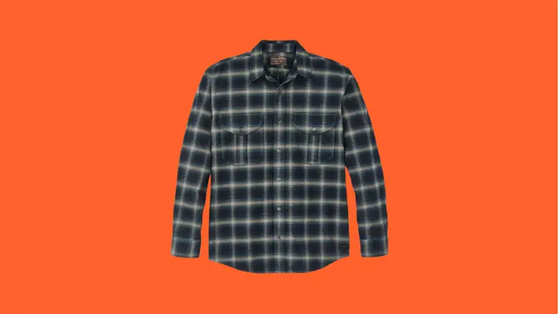 Navy plaid flannel shirt against orange background