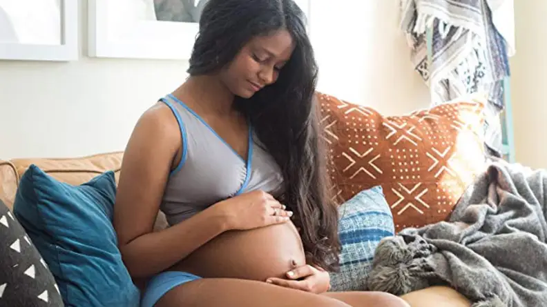Pregnant woman wearing bra