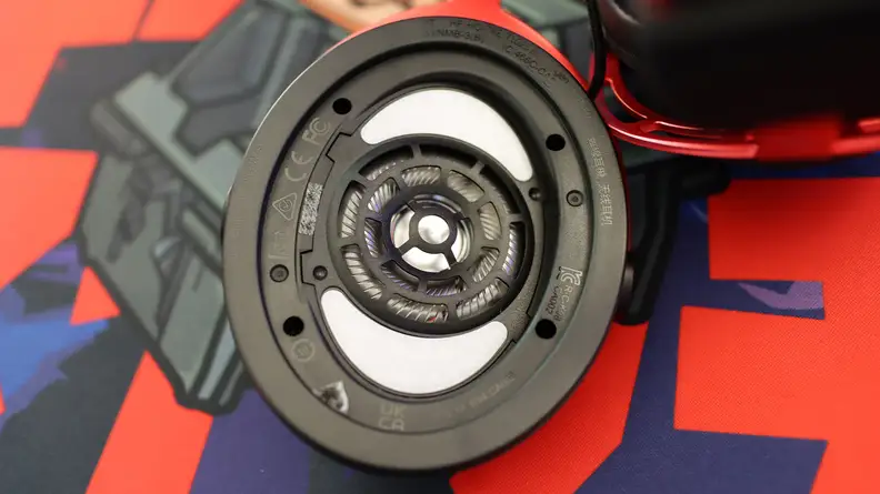 A close up of a gaming headset earcup with the cushion removed