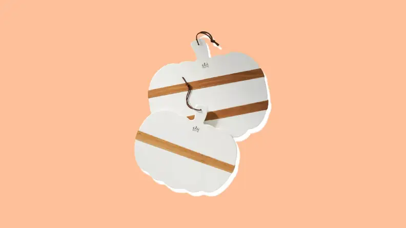 White and tan pumpkin-shaped charcuterie boards.