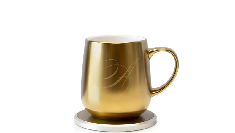 A golden, monogrammed mug, ready to keep your beverages warm all day.