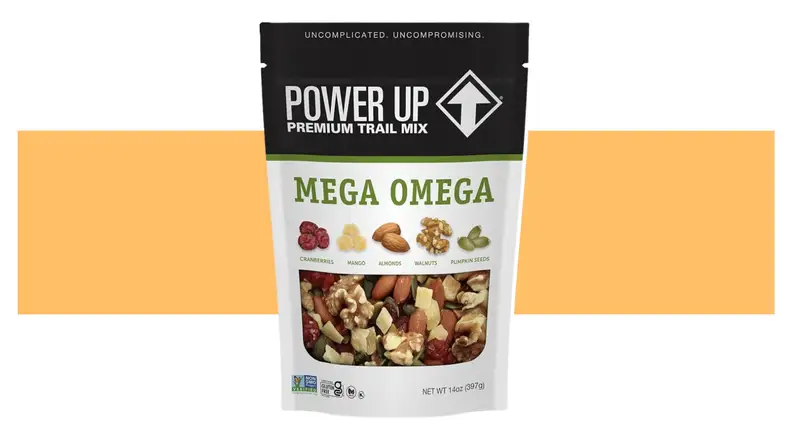 A Power Up bag of trail mix on an orange background.
