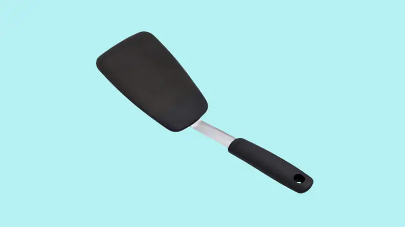 Spatula against cyan background