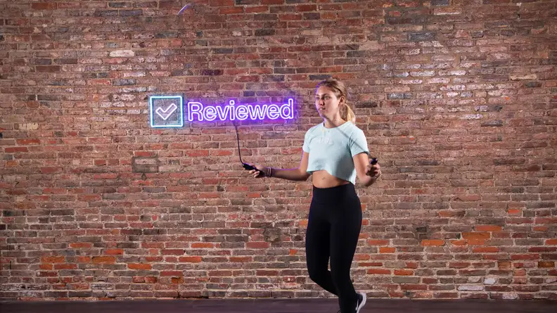 Person using the Tangram Factory SmartRope to exercise indoors.