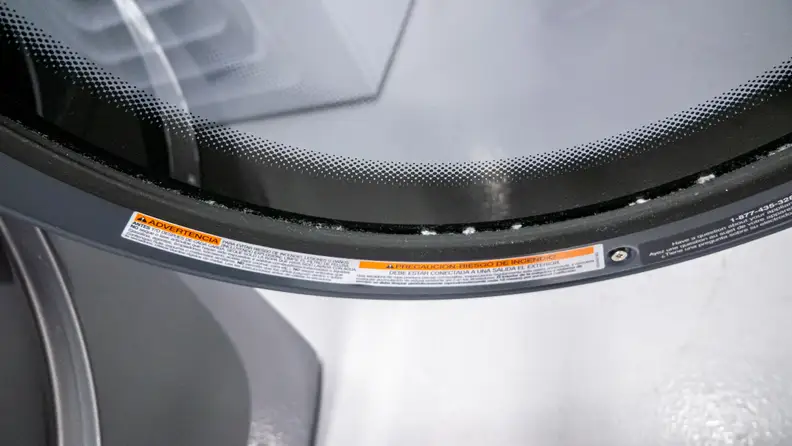 A dusting of lint covers the Electrolux dryer’s gasket.