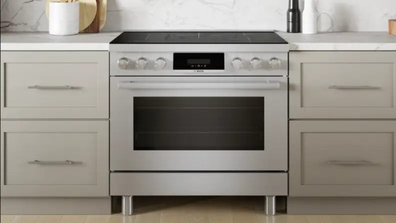 A range sits in cabinetry in a kitchen setting