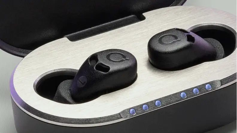Black QuietOn 4 Active Noise Cancelling Sleep Buds in their charging case.