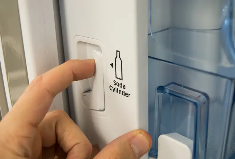 New CO2 canisters are loaded behind the left door using this latch.