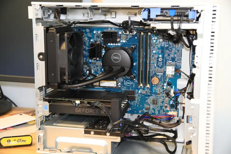 The interior of a Dell desktop tower showing the inner machinery.