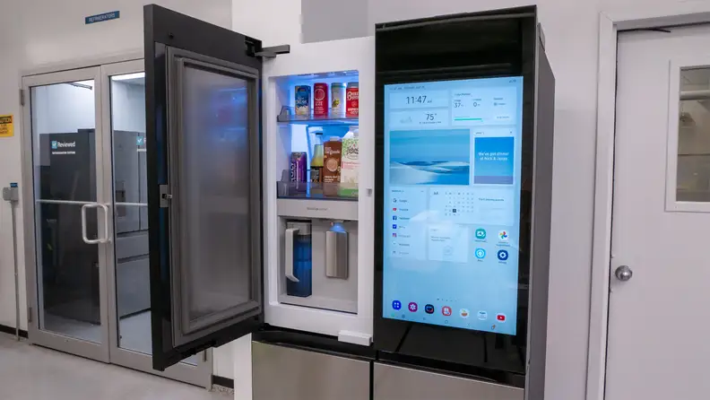 Samsung Bespoke Family Hub 4-door fridge with screeen on right and open door-in-door compartment on the left.