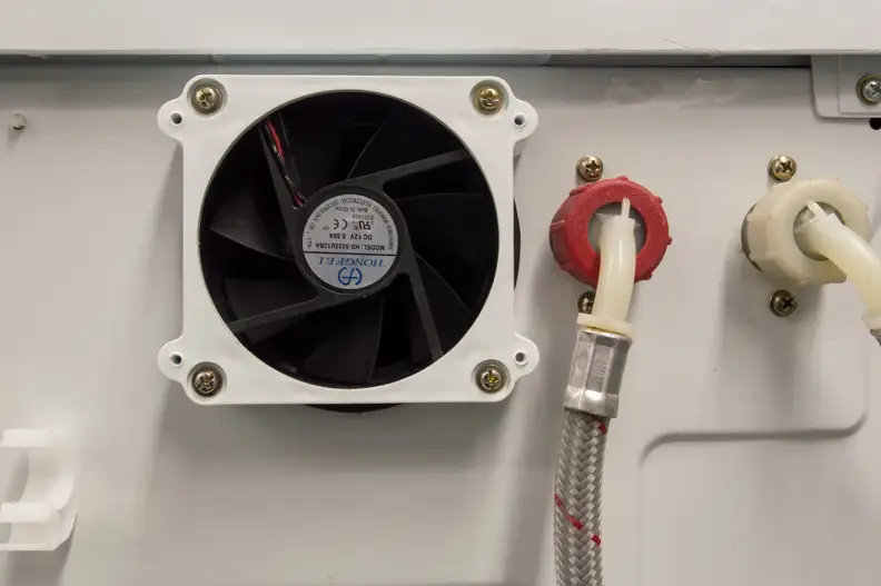 The fan in the back vents out moisture. Be sure to get plenty of metal ducting tape, since normal-sized vents won't fit properly.