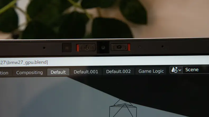 A closeup of the webcam and microphone on the laptop's bezel