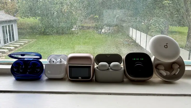 A grouping of earbuds on a window sill