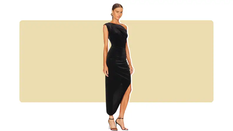 An asymmetrical black velvet dress.
