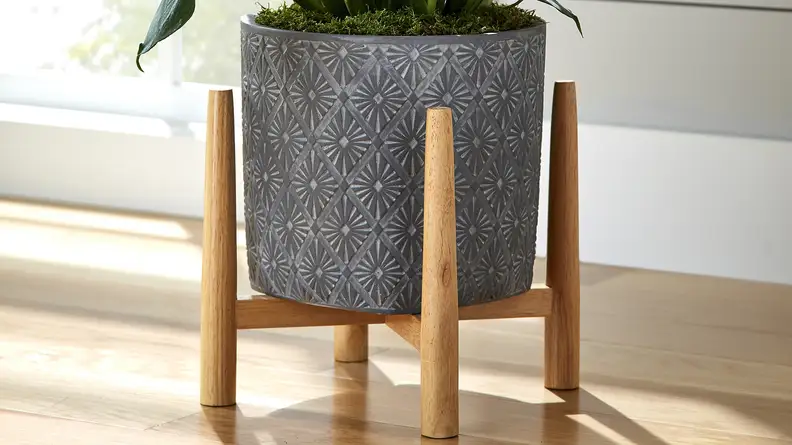 The concrete pot has a cool diamond texture on the outside.