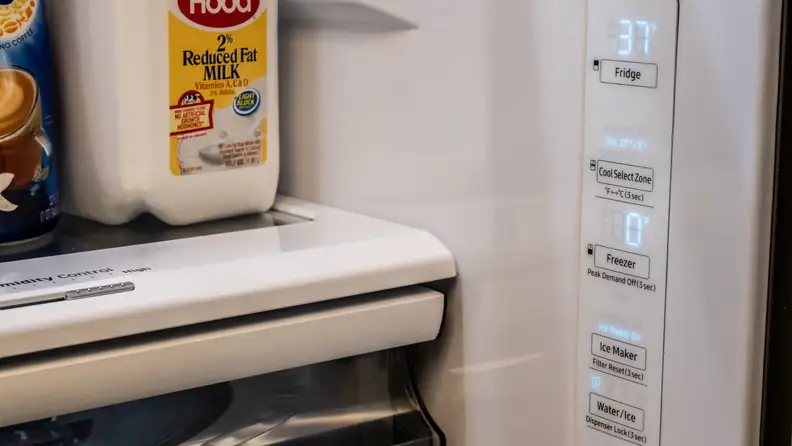 On the right wall of the inside of the Samsung RF28R6201SR refrigerator, we can see a control panel.